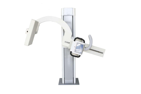 Sickle arm rotated to a lateral positioning position around a standing patient
